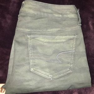 Green and black camo skinny jeans